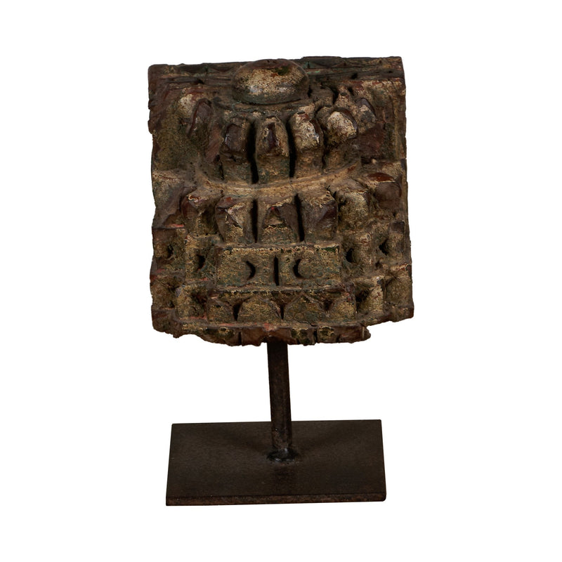 Carved Wooden Pillar Capital Fragments on Iron Stands by Studio Vastu