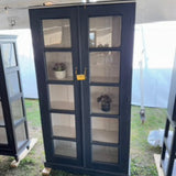 Timber Glass-Panel Display Cabinet by Studio Vastu